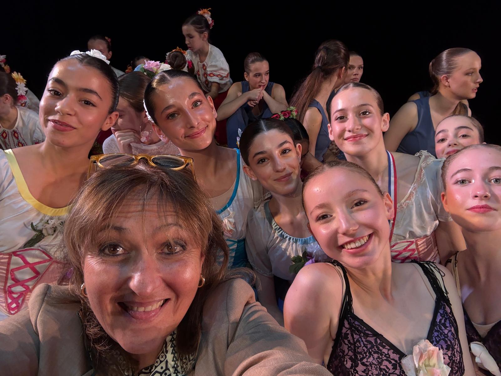 Dancers and teacher backstage
